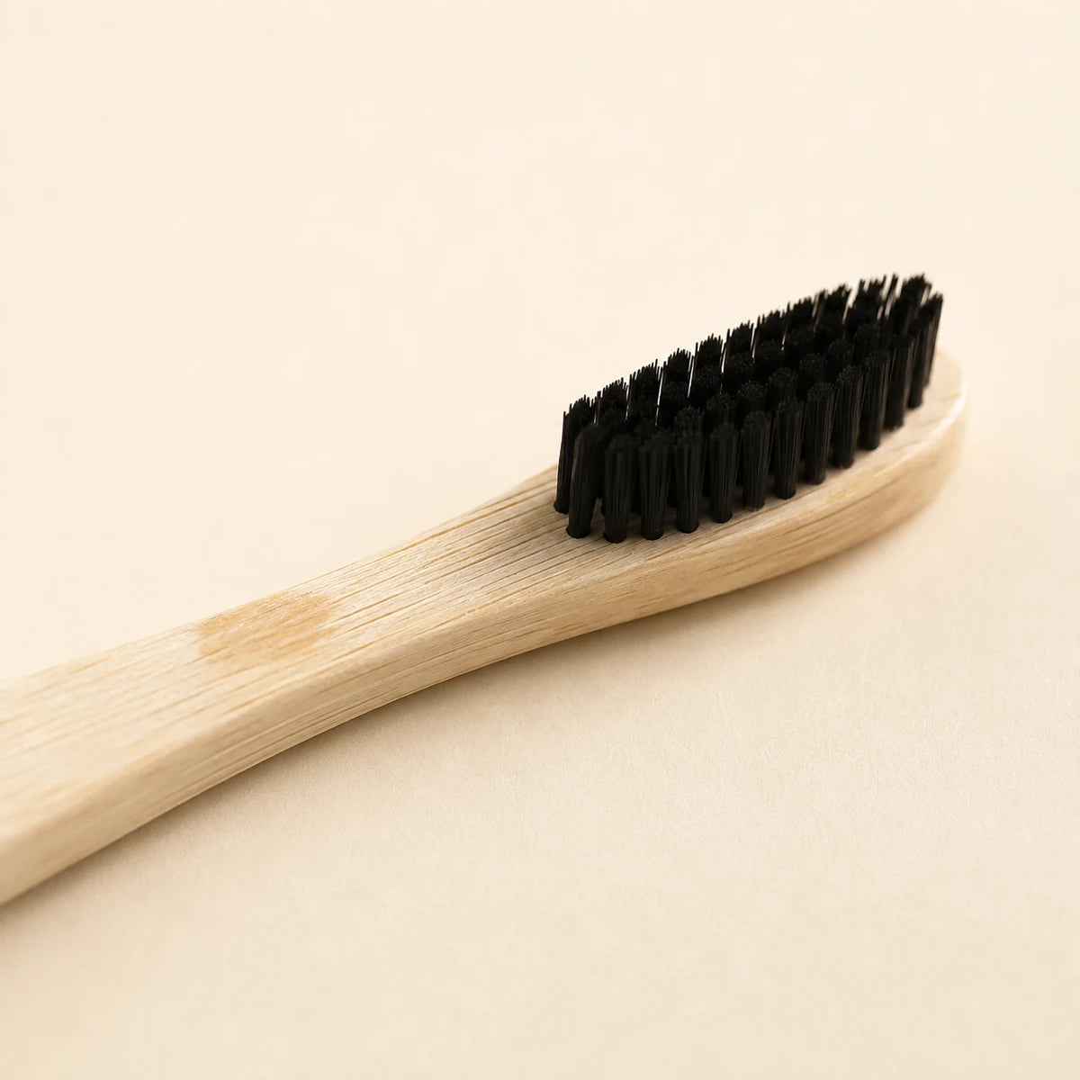 Bamboo toothbrush close-up - soft bristles and natural bamboo grain